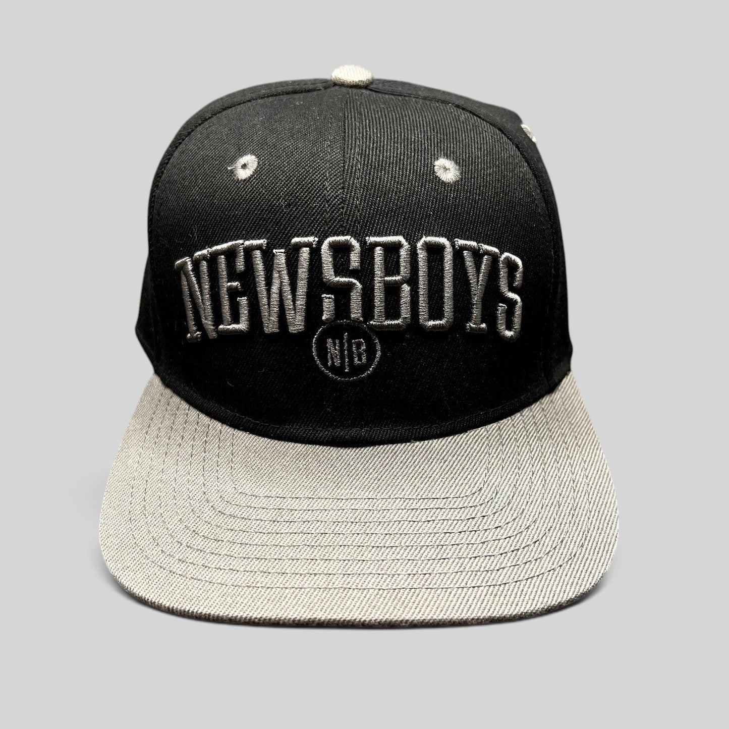 Raree Finds black and gray Newsboys Love Riot snapback hat with raised 3D lettering and flat brim