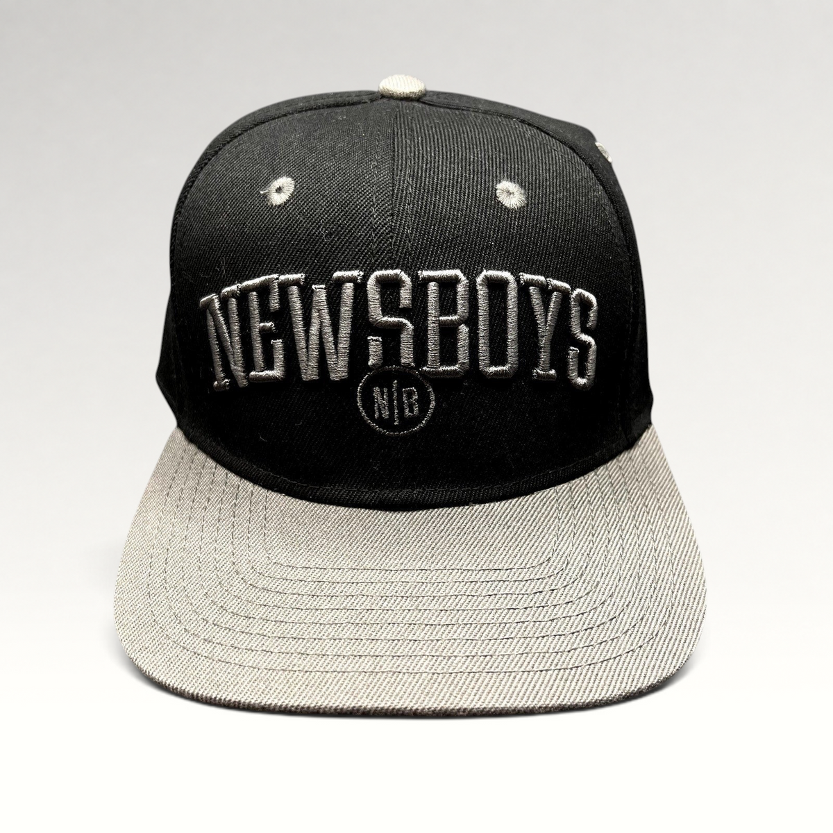 Raree Finds official Newsboys Love Riot snapback hat in black and gray with raised 3D embroidered lettering