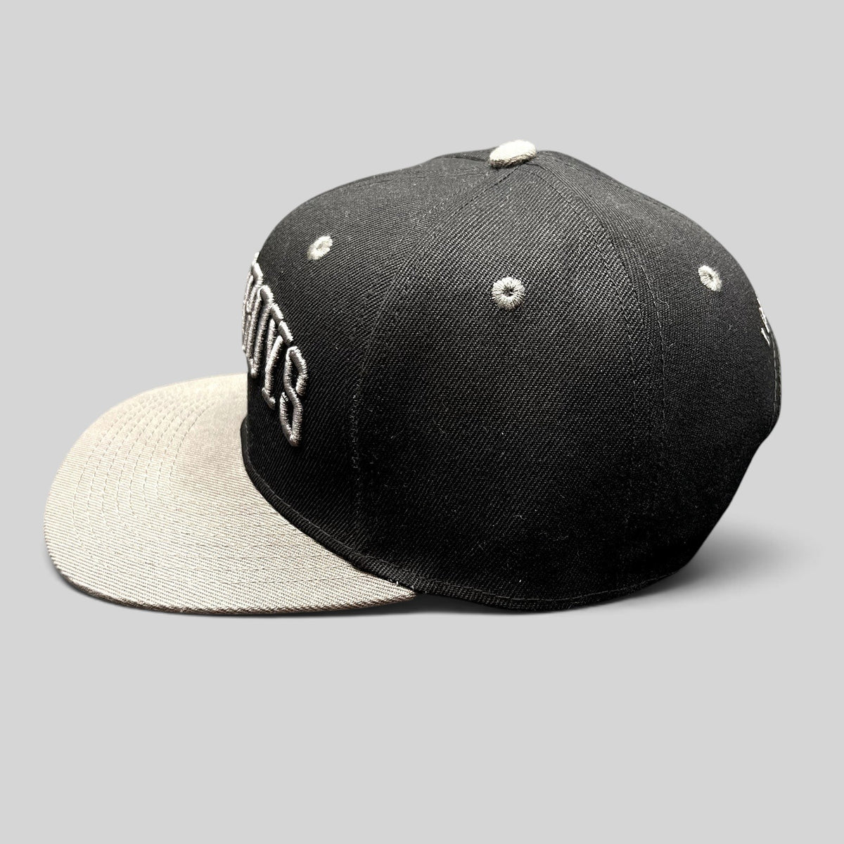 Raree Finds Newsboys Love Riot snapback hat in black and gray with 3D embroidered lettering and a flat brim.