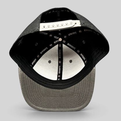 Raree Finds Newsboys Love Riot snapback hat interior showing custom branded taping and adjustable plastic closure
