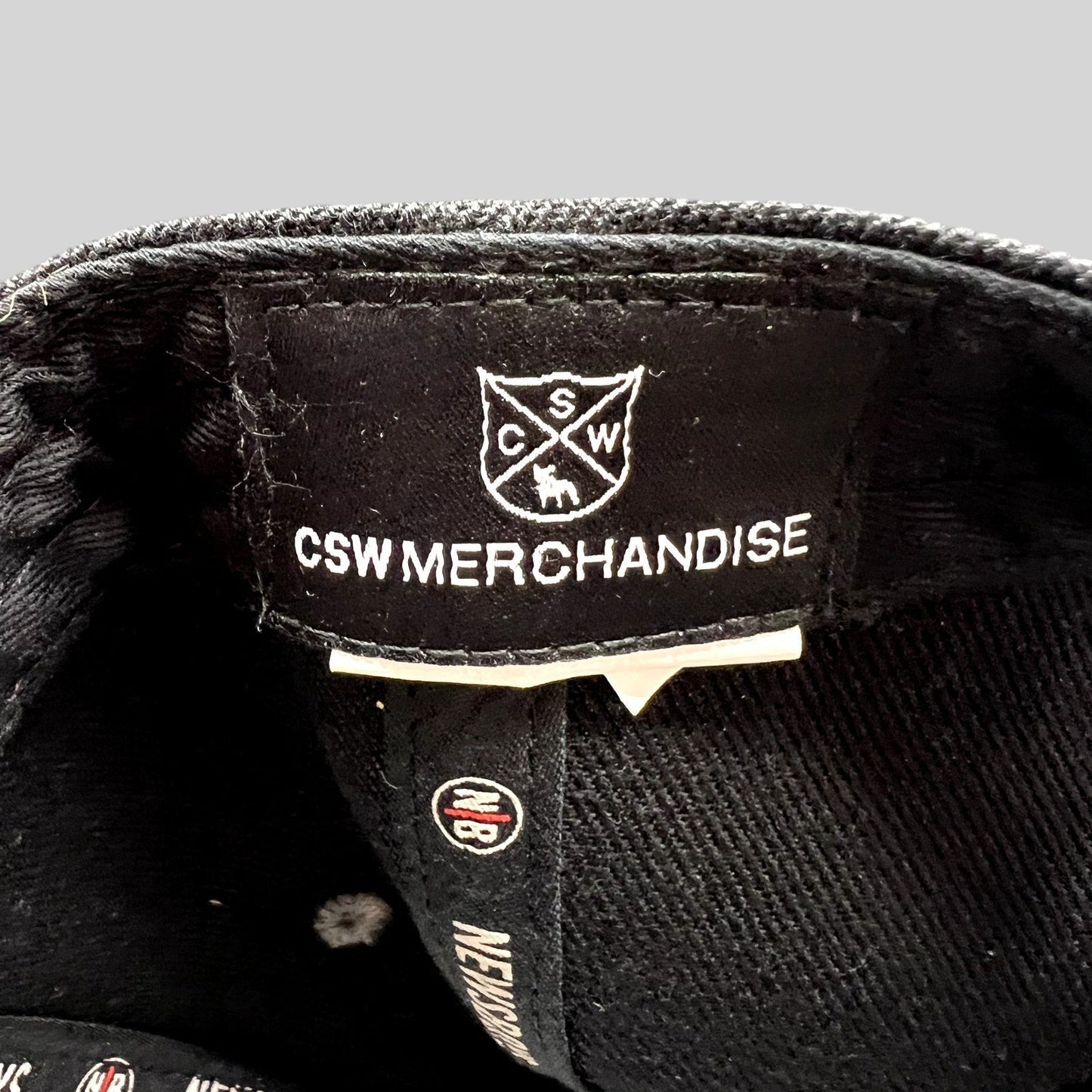 Raree Finds Newsboys Love Riot snapback hat interior label featuring CSW Merchandise branding and custom taping