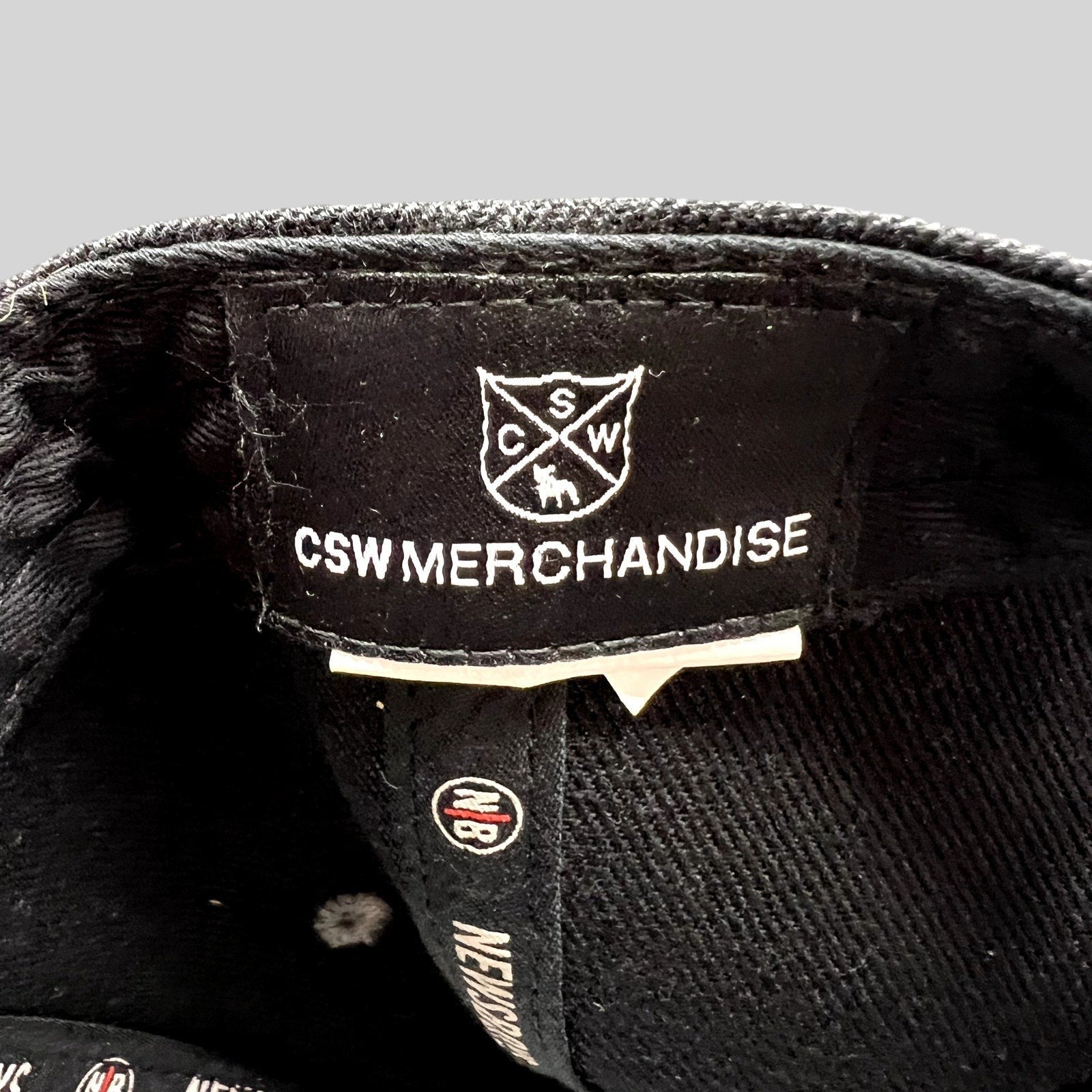Raree Finds Newsboys Love Riot snapback hat interior label featuring CSW Merchandise branding and custom taping