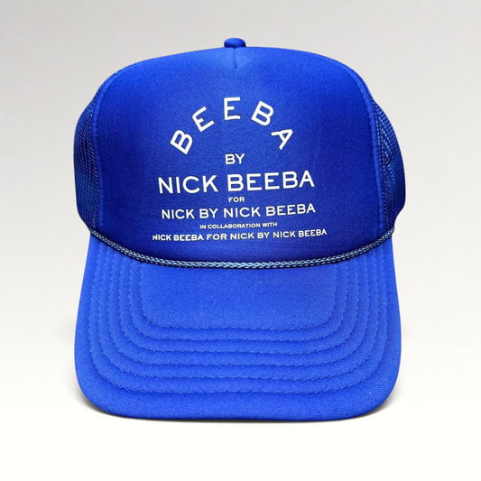 Raree Finds royal blue Otto foam trucker hat with white Nick Beeba promotional graphic and snapback closure.