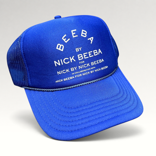 Raree Finds royal blue Otto foam-front trucker hat with white Nick Beeba promotional graphic and mesh back