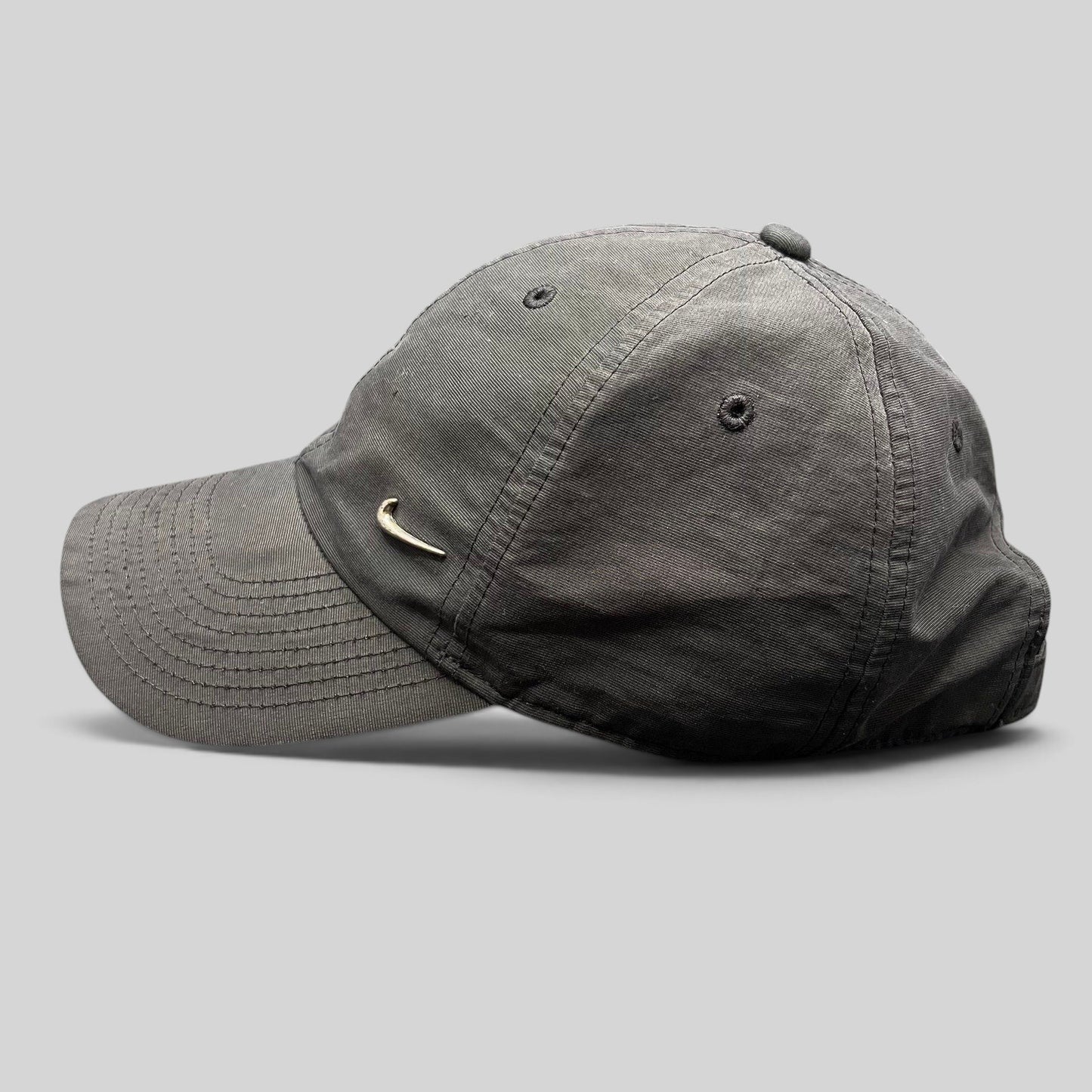 Raree Finds Nike Heritage 86 black unstructured strapback hat with a small metallic silver Swoosh logo on the front.