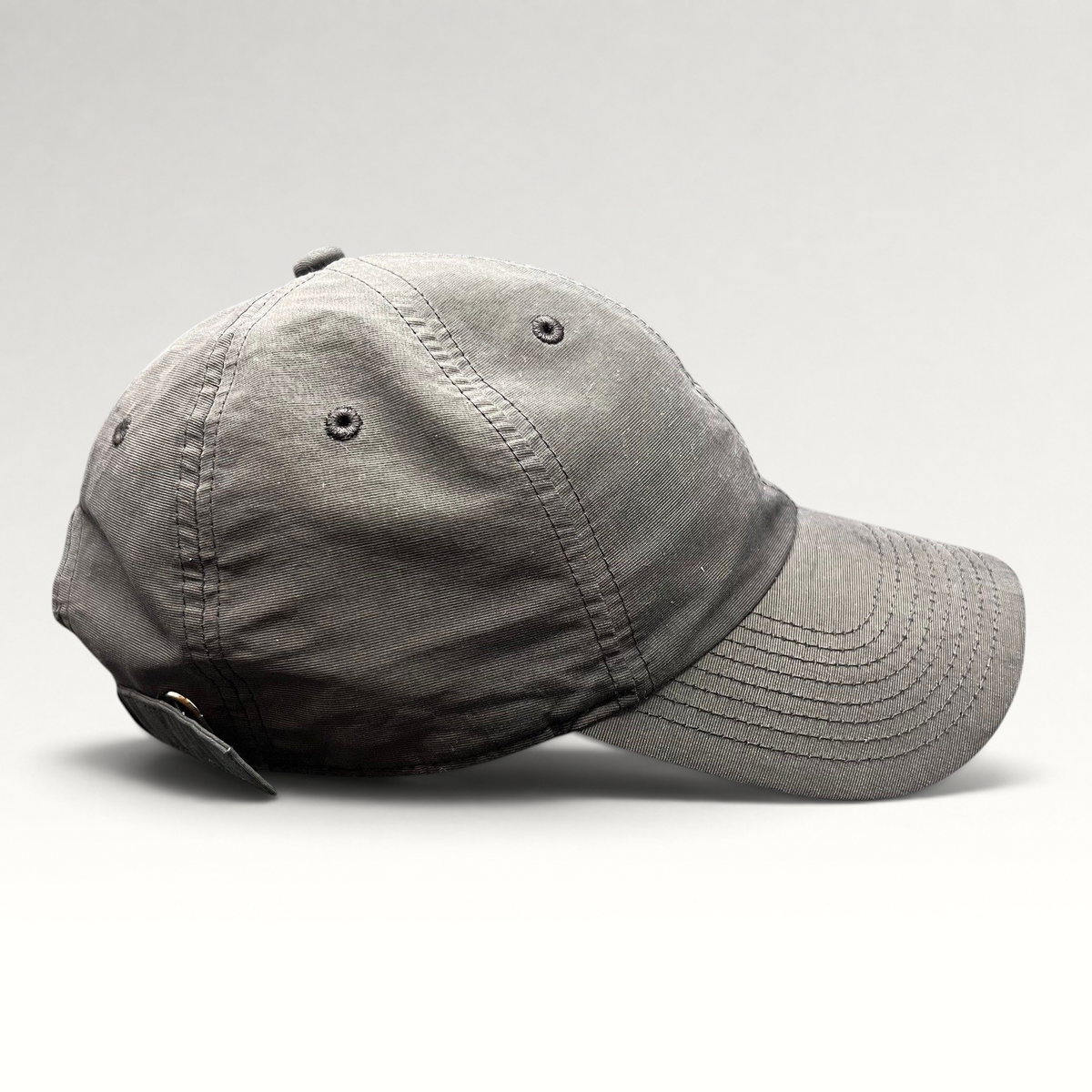 Raree Finds Nike Heritage 86 black unstructured strapback hat with a minimalist mini metal Swoosh logo