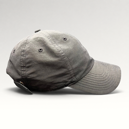 Raree Finds Nike Heritage 86 black unstructured strapback hat with a minimalist mini metal Swoosh logo