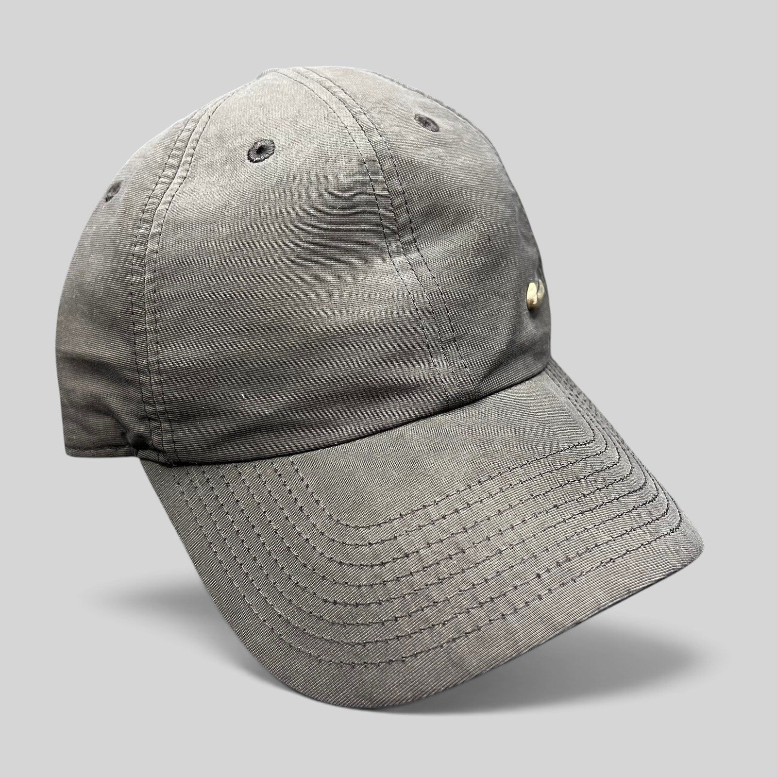 Raree Finds black Nike Heritage 86 unstructured strapback hat with a small metallic Swoosh logo on the front panel