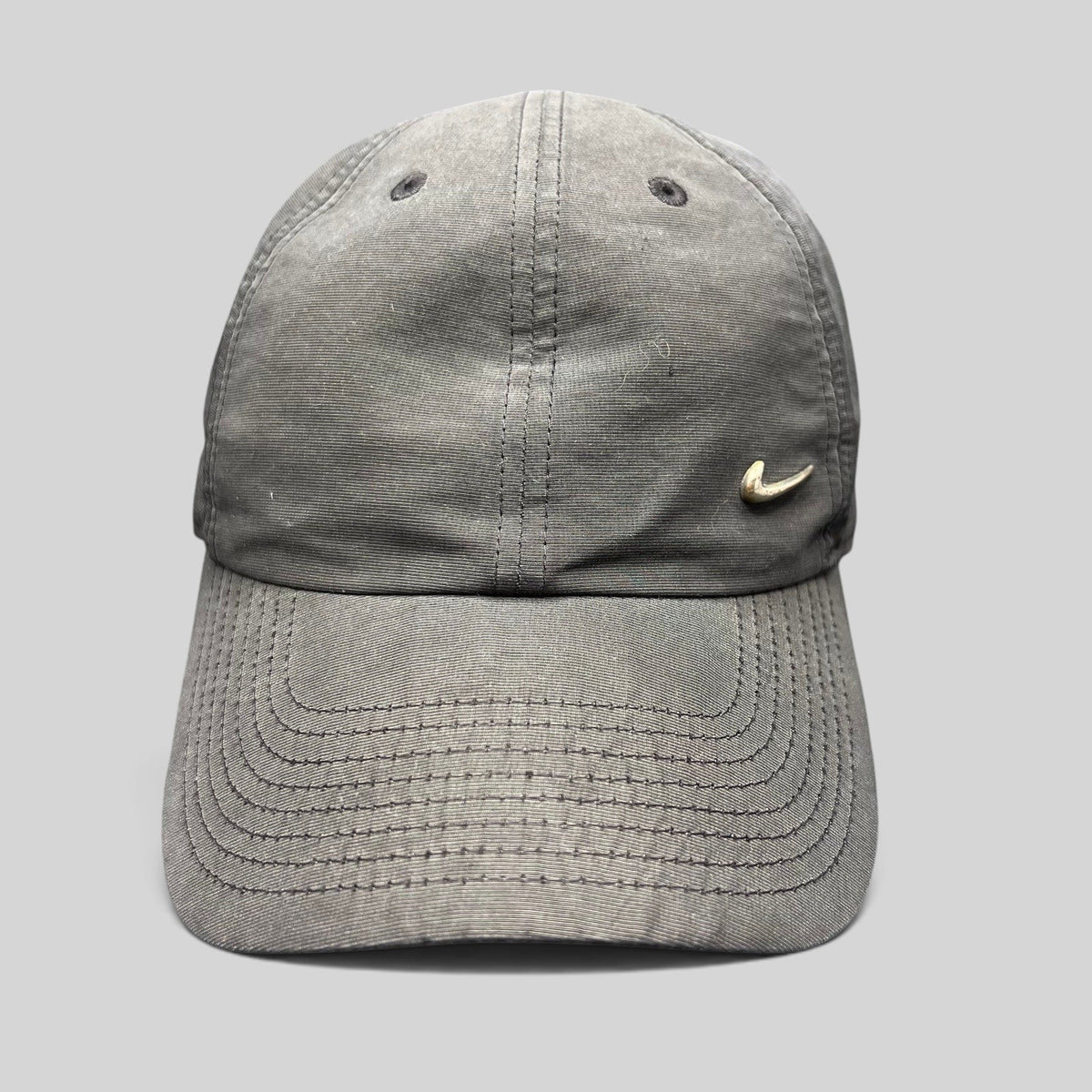 Raree Finds Nike Heritage 86 black unstructured strapback hat with a small metallic silver Swoosh logo on the front.