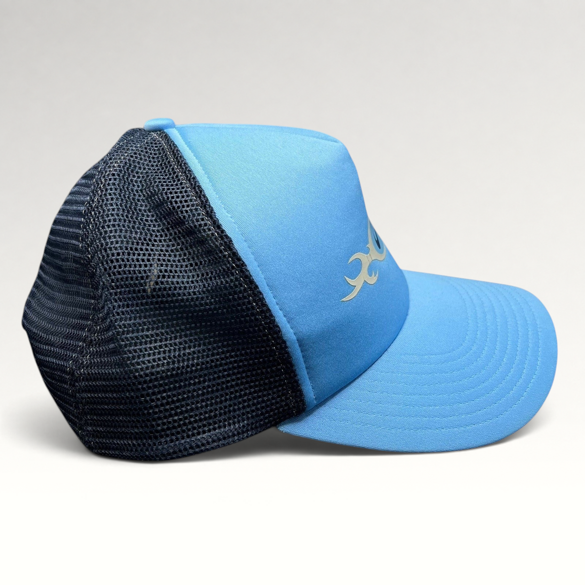 Raree Finds vintage Nike light blue trucker hat with navy mesh back and tribal-style swoosh logo graphic