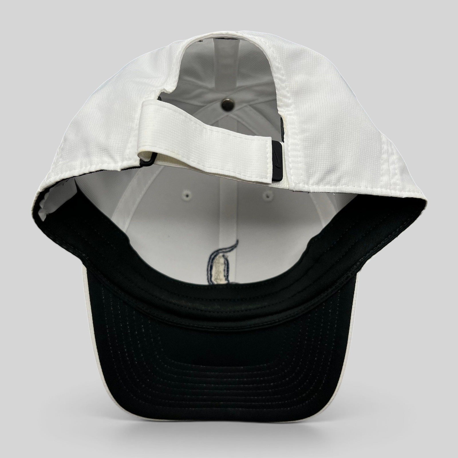 Raree Finds white Nike Legacy 91 Disney cap showing the interior structure and adjustable strapback closure