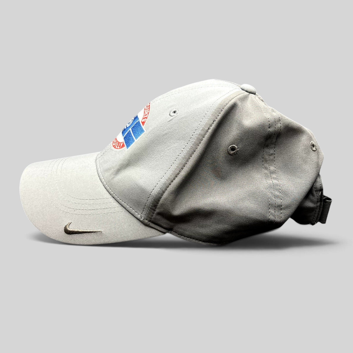 Raree Finds gray Nike Dri-FIT Legacy91 tennis hat with The Courts @ Piccadilly logo and metallic Swoosh on the visor.