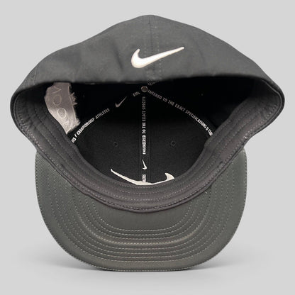 Raree Finds Nike Golf black fitted cap with white Swoosh logo and interior performance taping