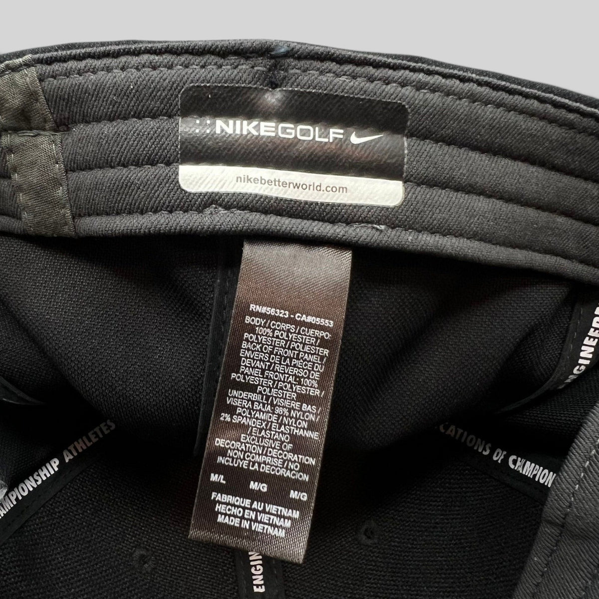 Raree Finds Nike Golf black fitted cap interior label showing material composition and branding details