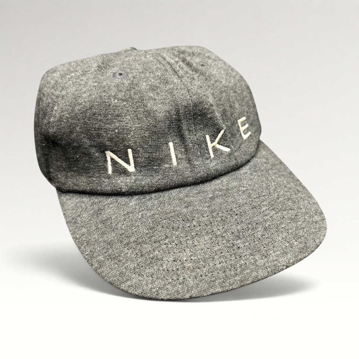 Raree Finds vintage Nike heather gray cotton strapback hat with minimalist white embroidered spellout logo