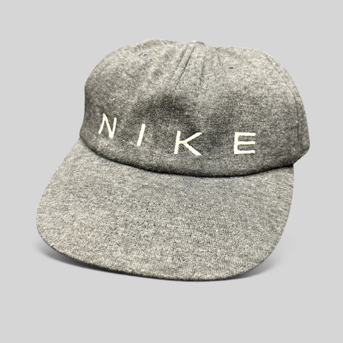 Raree Finds vintage Nike heather gray cotton strapback hat with minimalist white embroidered spellout logo
