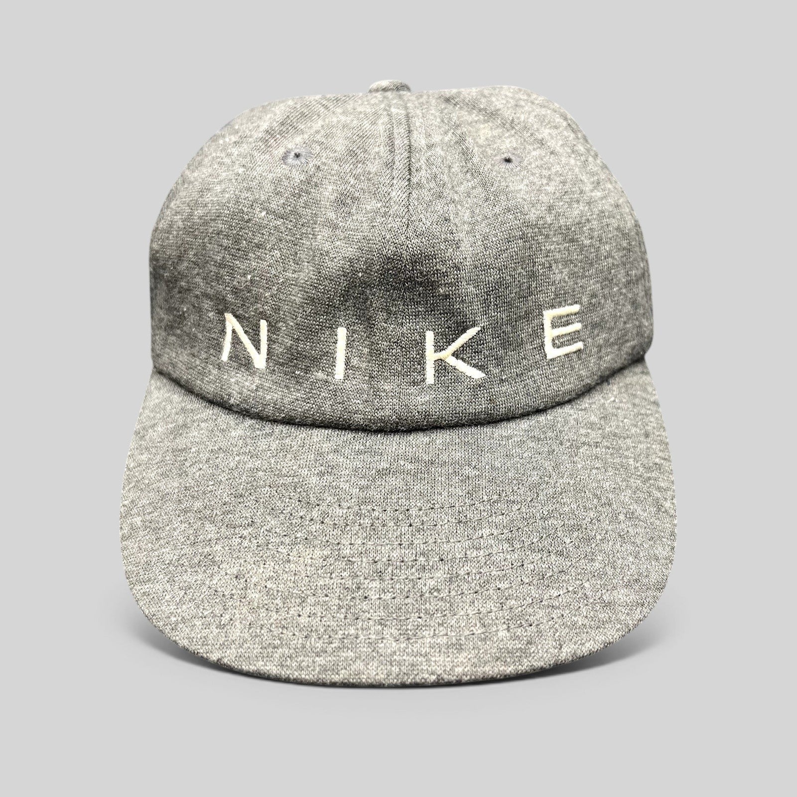 Raree Finds vintage Nike heather gray cotton strapback hat with white embroidered spellout logo on unstructured crown