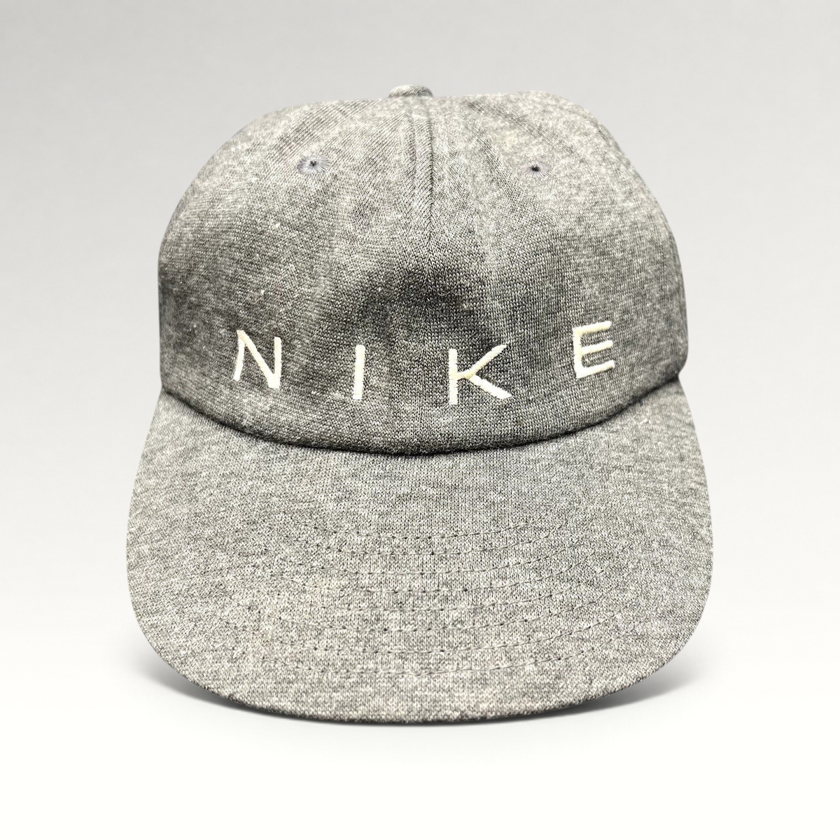Raree Finds vintage Nike heather gray cotton strapback hat with white embroidered spellout logo on unstructured crown