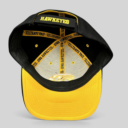 Raree Finds vintage Nike Iowa Hawkeyes strapback hat showing interior branded taping and gold embroidery on black