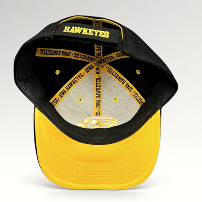 Raree Finds vintage Nike Iowa Hawkeyes strapback hat showing interior branded taping and gold embroidery on black