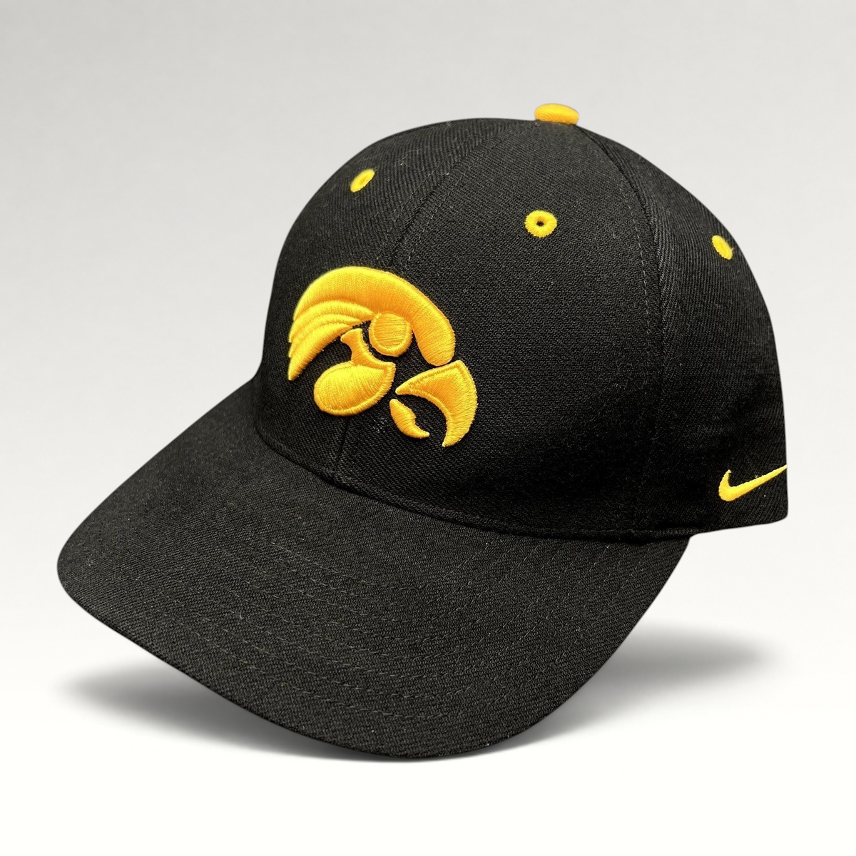 Raree Finds vintage Nike Iowa Hawkeyes strapback hat in black cotton twill with gold embroidered team logo and swoosh.