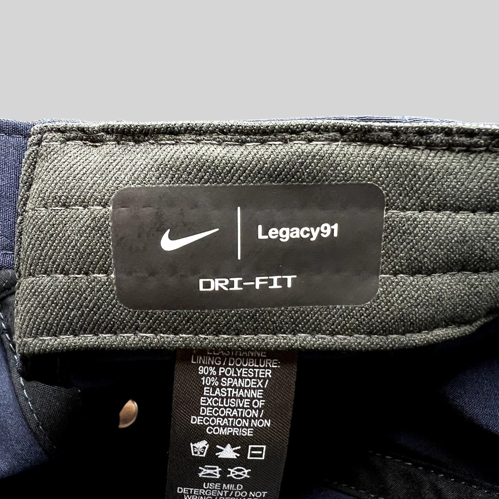Raree Finds Nike Legacy91 Dri-FIT hat interior label showing material composition and branding details