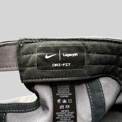Raree Finds Nike Legacy91 Dri-FIT hat interior tag showing fabric composition and branding details