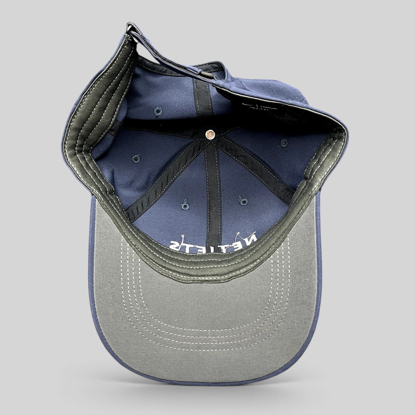 Raree Finds navy blue Nike Legacy91 NetJets cap interior showing structured six-panel construction and strapback.