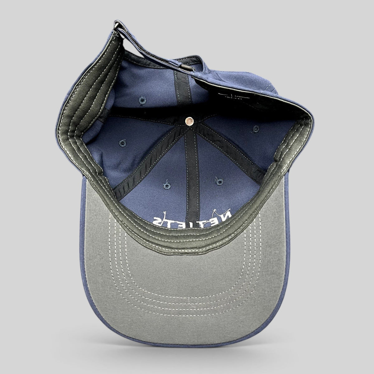 Raree Finds navy blue Nike Legacy91 NetJets cap interior showing structured six-panel construction and strapback.