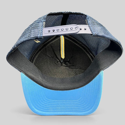 Raree Finds vintage Nike trucker hat showing the interior mesh back, adjustable snapback closure, and blue brim.