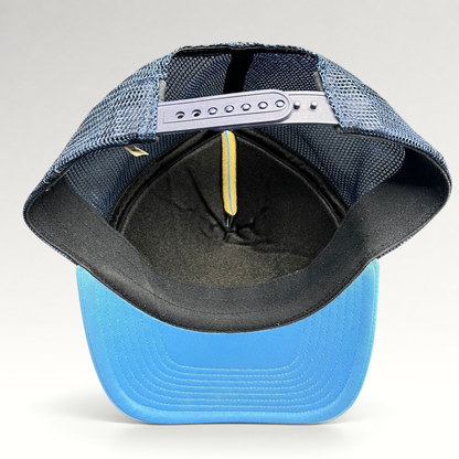 Raree Finds vintage Nike trucker hat showing the interior mesh back, adjustable snapback closure, and blue brim.