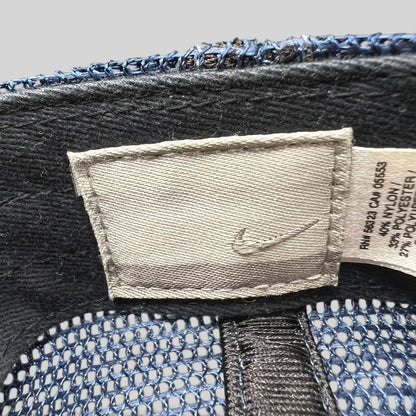 Raree Finds vintage Nike trucker hat interior tag with swoosh logo and fabric composition details