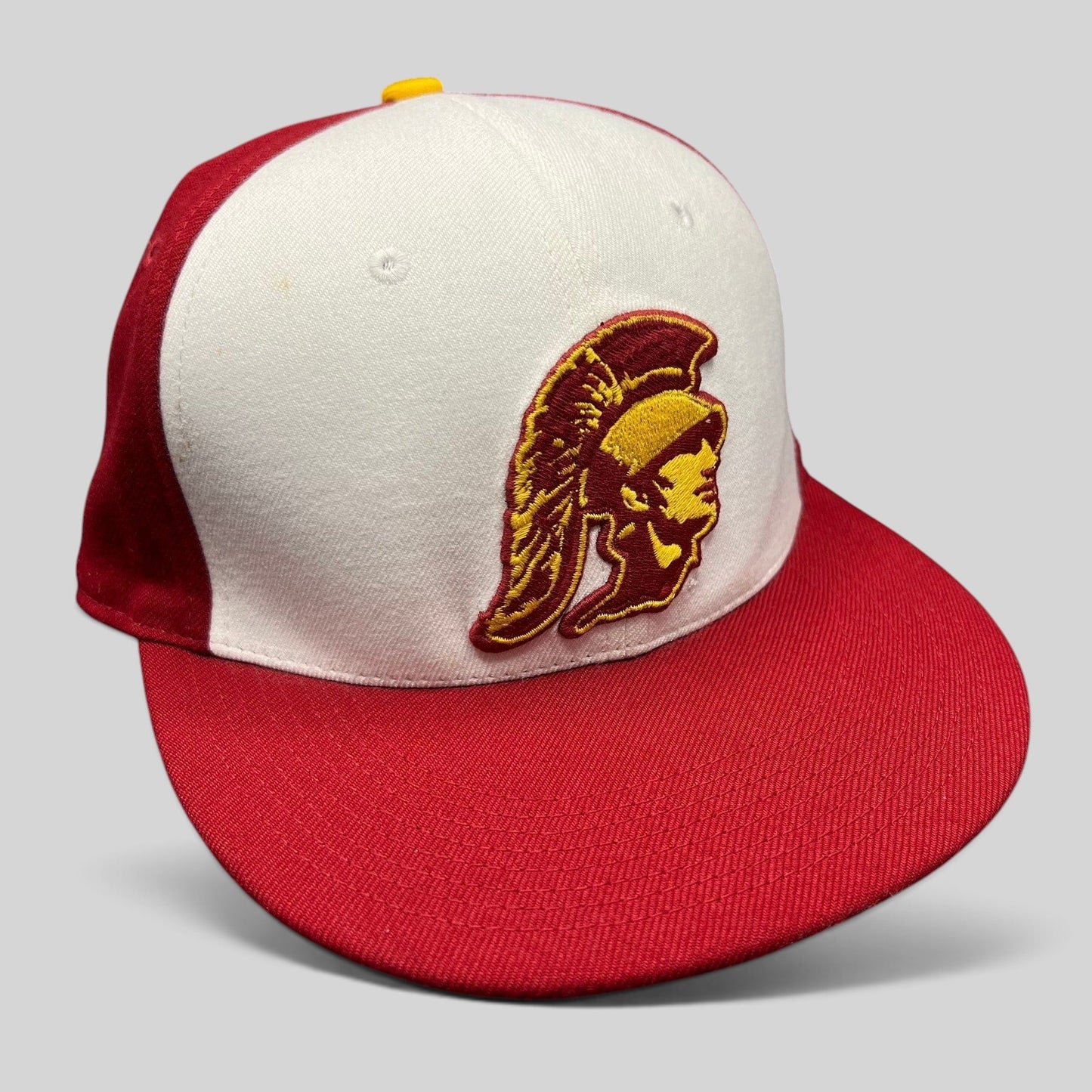 Raree Finds vintage Nike USC Trojans fitted hat with cardinal and gold Trojan helmet logo on a white and red cap.