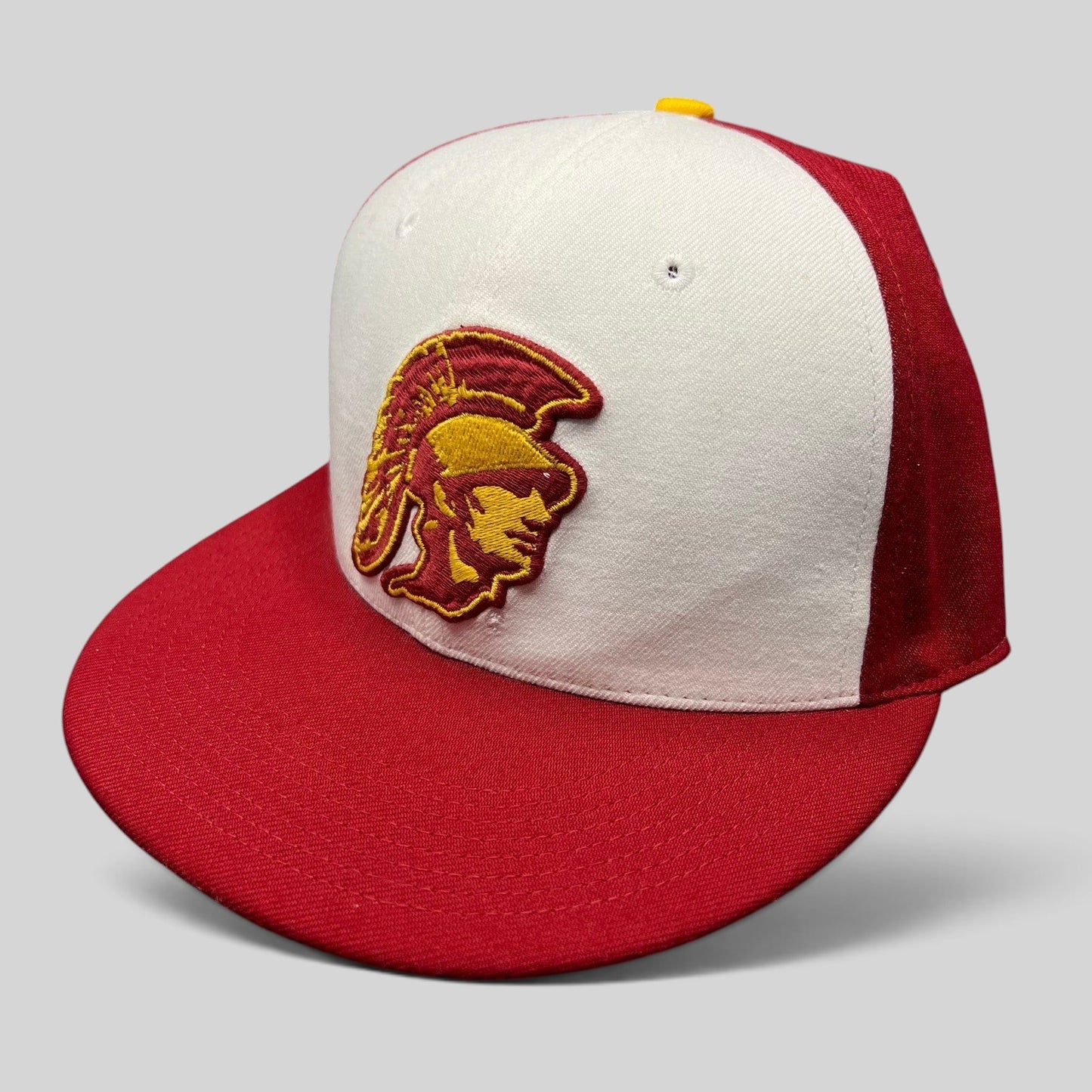 Raree Finds vintage Nike USC Trojans fitted hat with red and white panels and embroidered Trojan helmet logo.