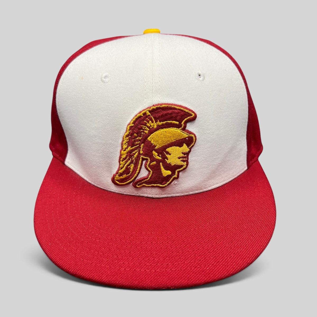 Raree Finds vintage Nike USC Trojans fitted hat with cardinal and gold Trojan helmet logo on a white and red cap