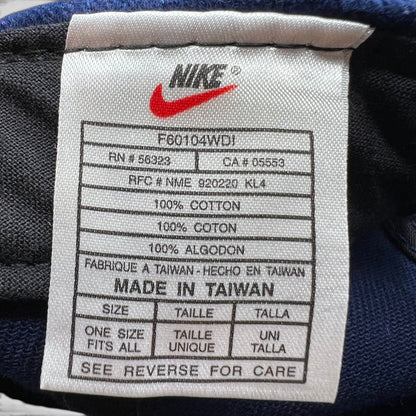 Raree Finds vintage Nike Team Sports hat interior care label showing 100% cotton material and made in Taiwan details.