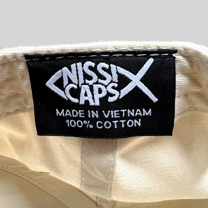 Raree Finds vintage Nissin Caps label inside a cream cotton snapback hat showing manufacturing details