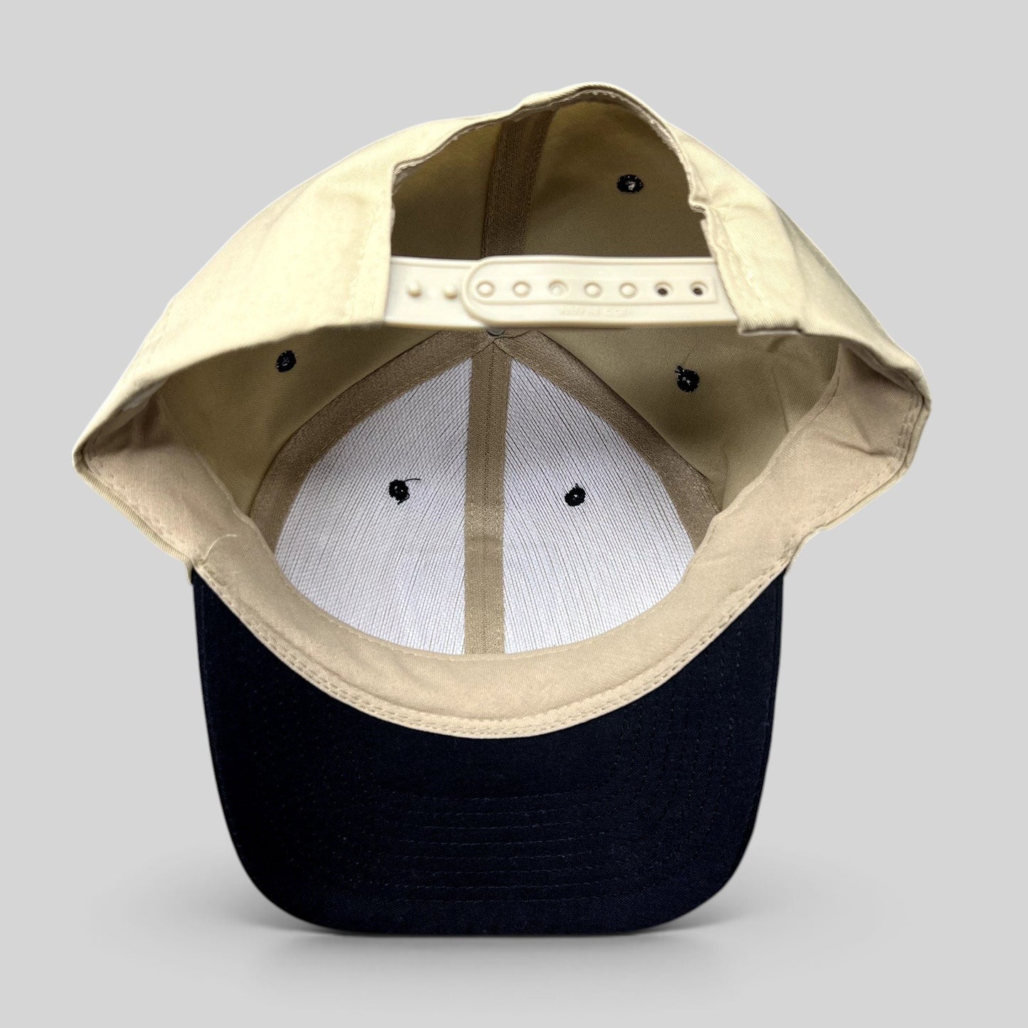 Raree Finds vintage Nissin Hawaii 5-0 police snapback hat showing the interior khaki cotton crown and black brim