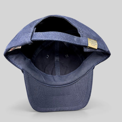 Raree Finds vintage Nissun navy blue cotton strapback hat showing the adjustable metal clasp closure