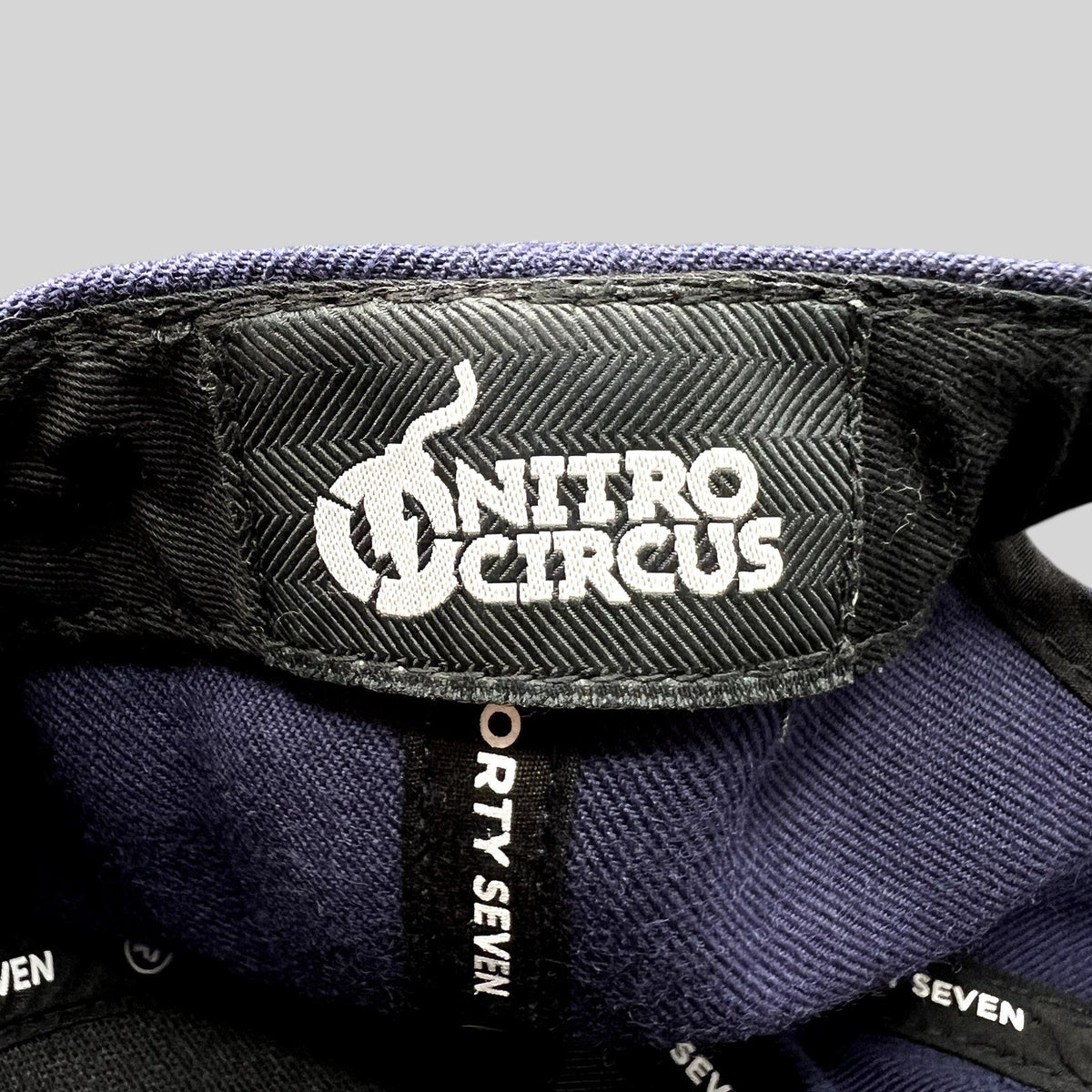 Raree Finds ’47 Brand Nitro Circus snapback hat interior label featuring white embroidered logo on navy fabric