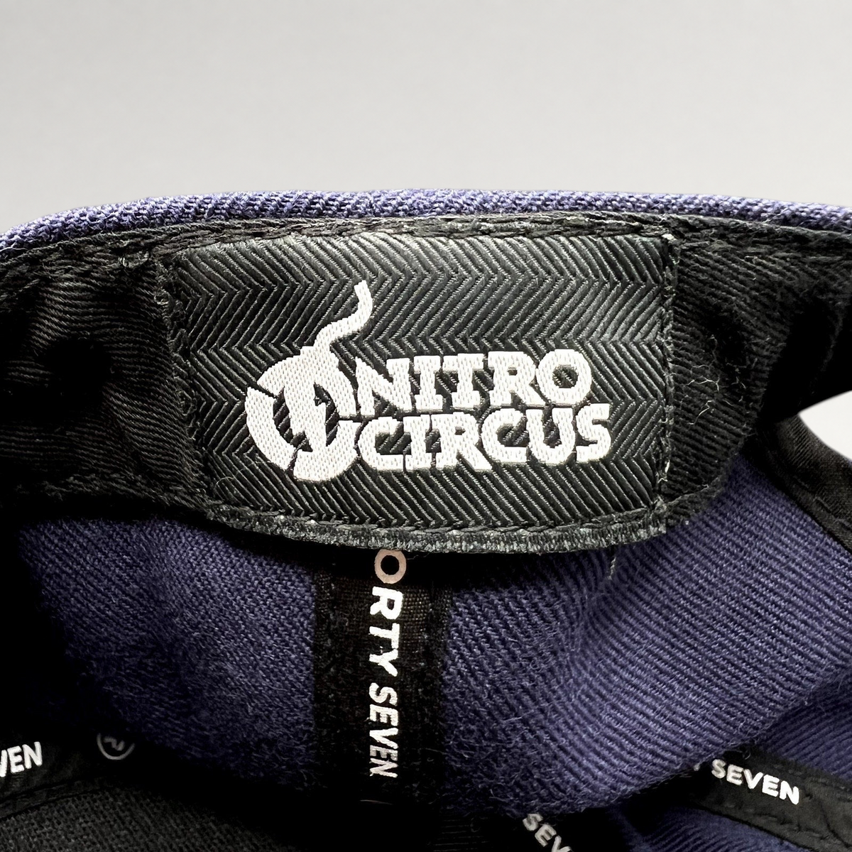 Raree Finds ’47 Brand Nitro Circus snapback hat interior label featuring white embroidered logo on navy fabric