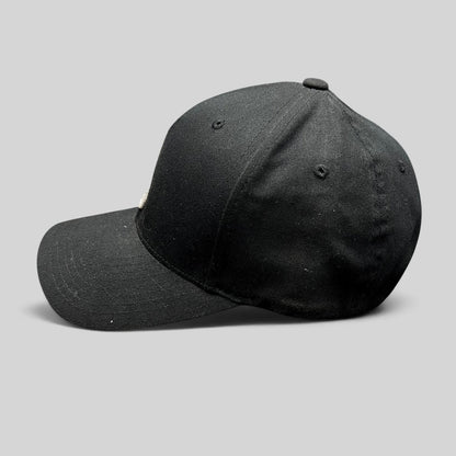 Raree Finds black Nixon Watches Flexfit fitted cap with white embroidered logo, side profile view.