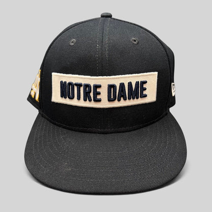 Raree Finds black Notre Dame Fighting Irish New Era 9FIFTY snapback hat with cream and navy wordmark patch