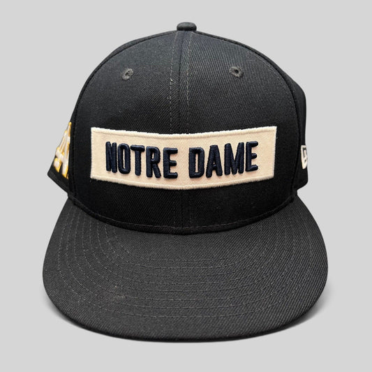 Raree Finds black Notre Dame Fighting Irish New Era 9FIFTY snapback hat with cream and navy wordmark patch