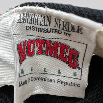Raree Finds vintage Nutmeg Mills and American Needle clothing label tag from a 1990s Los Angeles Dodgers snapback hat.
