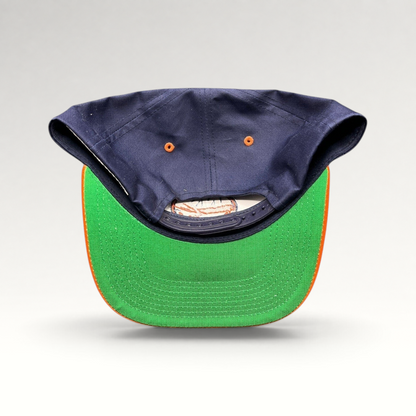 Raree Finds vintage New York Islanders snapback hat showing the navy crown, orange brim, and classic green undervisor.