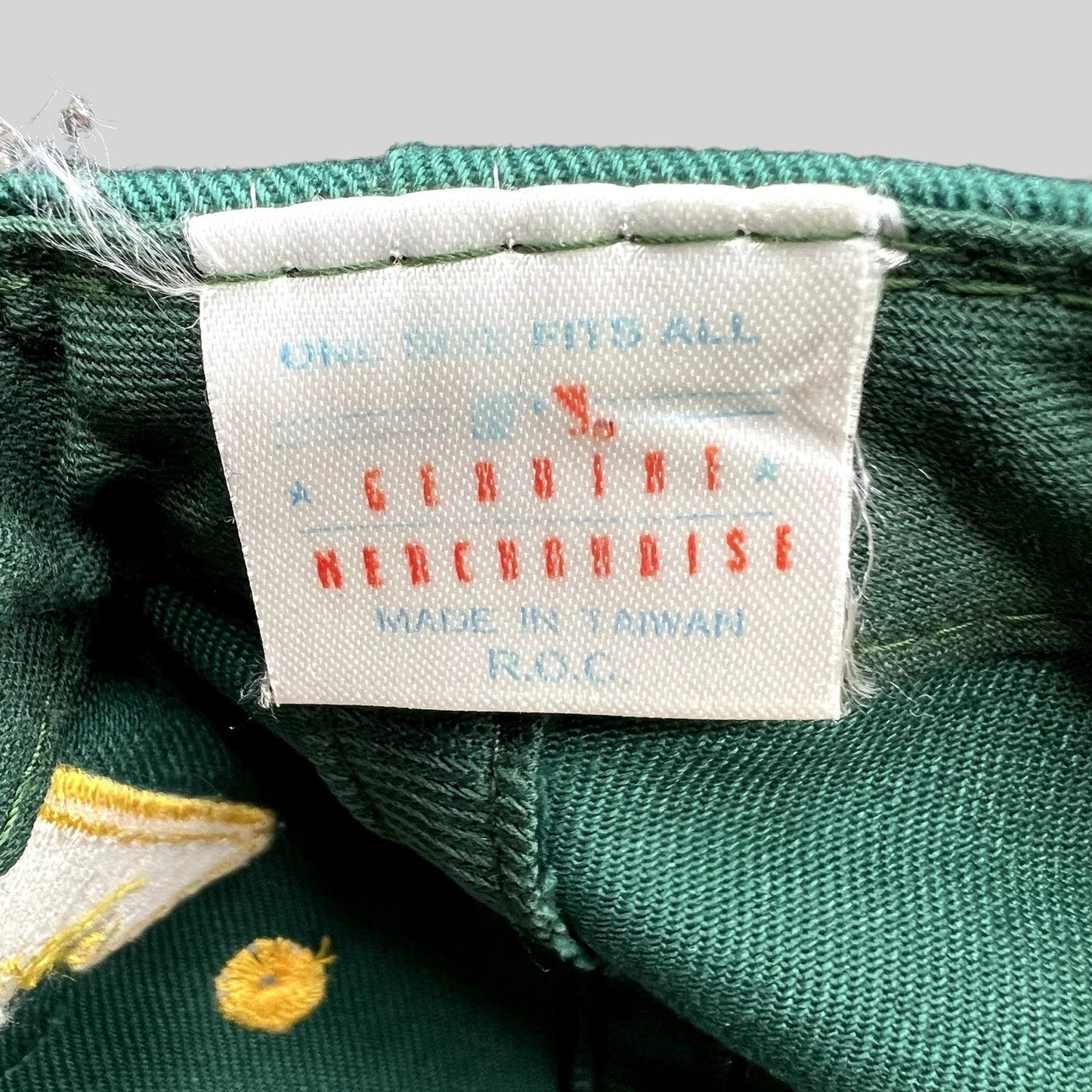 Raree Finds vintage 90s Oakland Athletics snapback hat interior tag showing Genuine Merchandise and Made in Taiwan