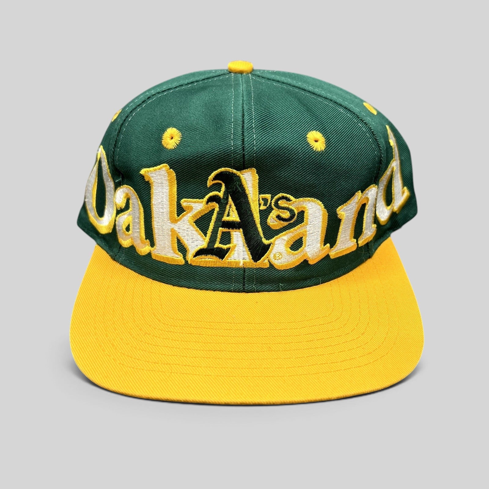Raree Finds vintage 90s Oakland Athletics Logo 7 snapback hat with oversized green and yellow script embroidery