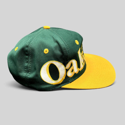Raree Finds vintage 90s Oakland Athletics Logo 7 snapback hat with oversized green and yellow script embroidery