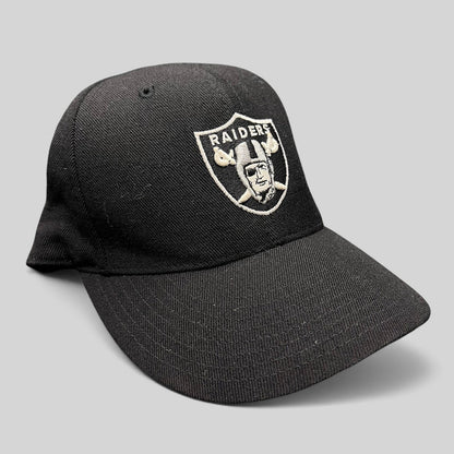 Raree Finds vintage black Oakland Raiders Reebok fitted hat with silver embroidered shield logo on wool blend fabric